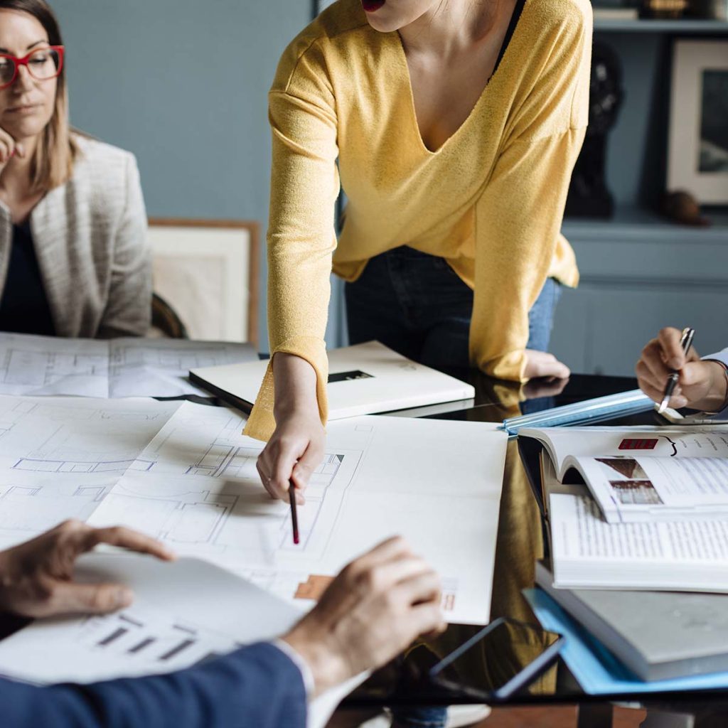 Architects having a meeting discussing a project FJH98LP.jpg